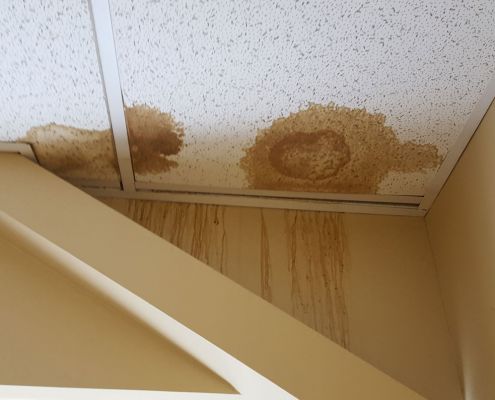 Bad roof leak caused by blown off shingles
