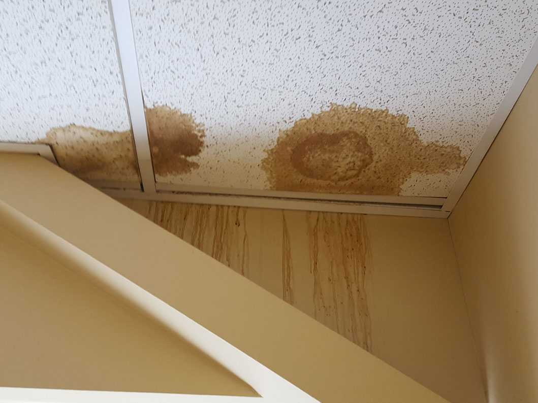 Bad roof leak caused by blown off shingles